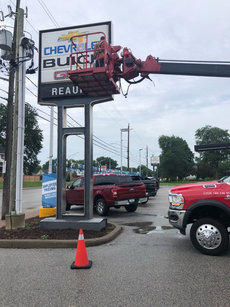 Yesco bucket ladder servicing a 20 foot sign for Reaume-Chevrolet Buick dealership