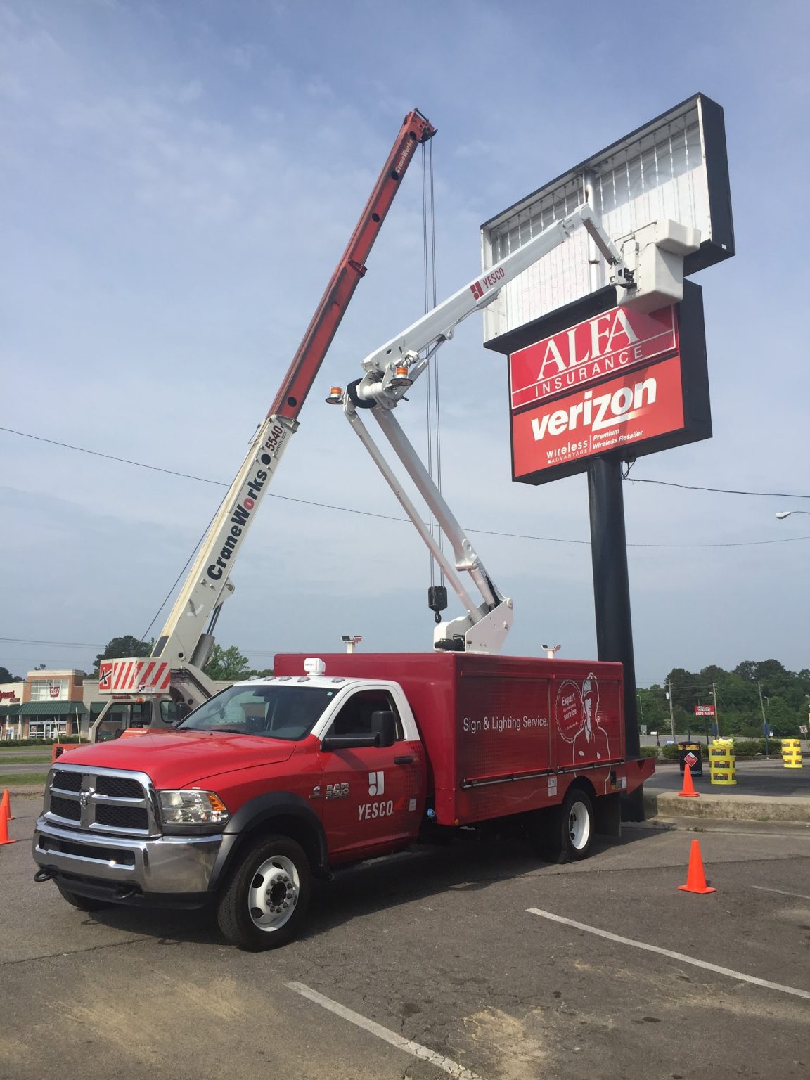 Yesco vehicle reparing the flourescent light sign board