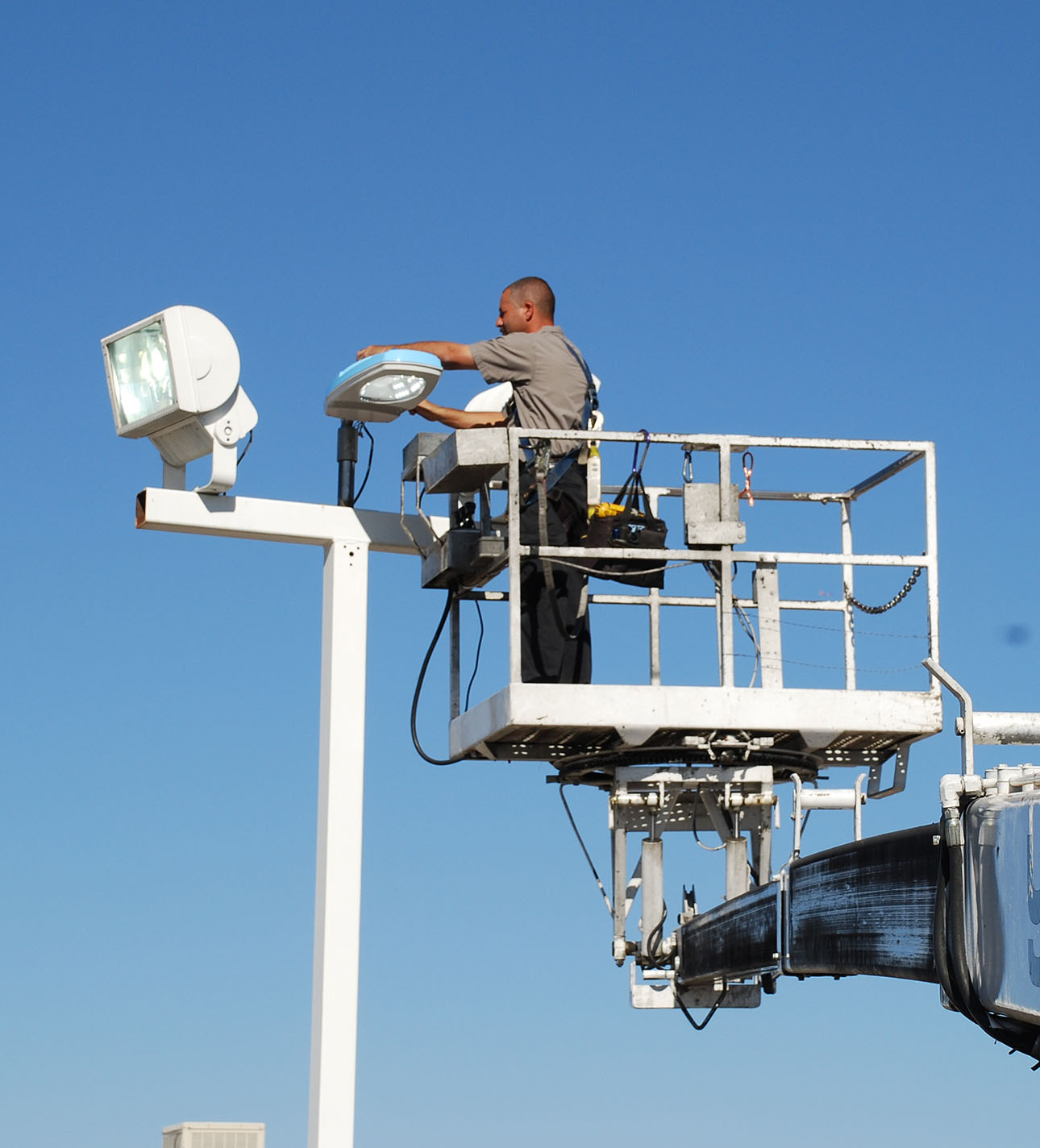 A Worker is fixing the street light