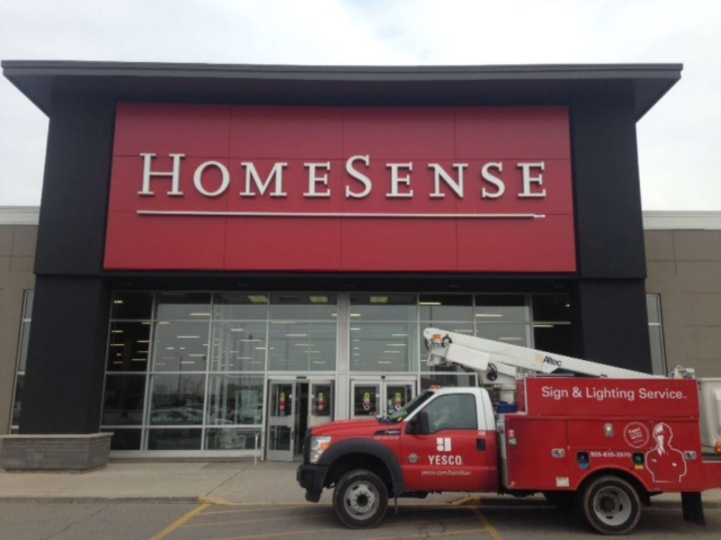 a photo of the Home Sense sign that red with white lettering