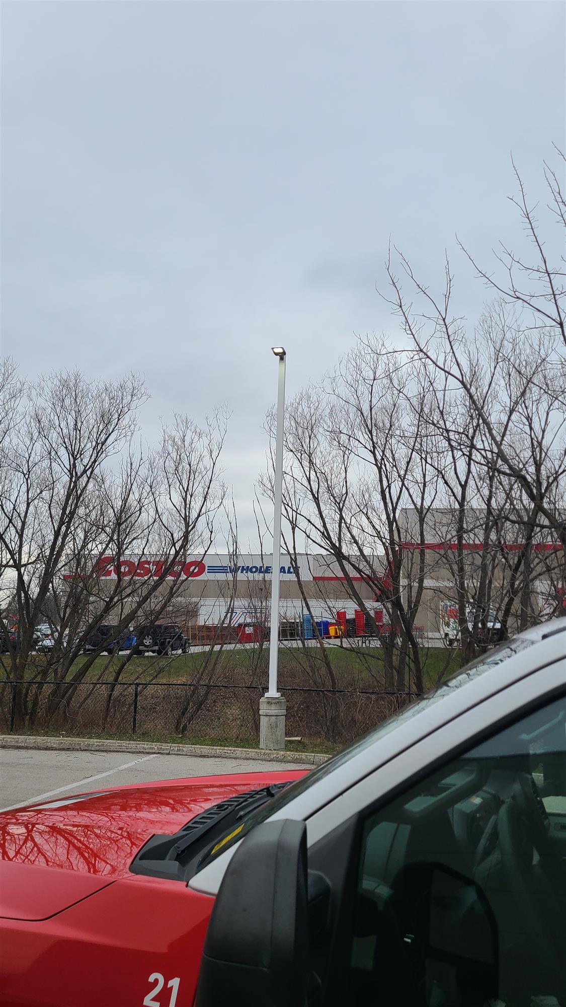 a pole light in parking lot with truck