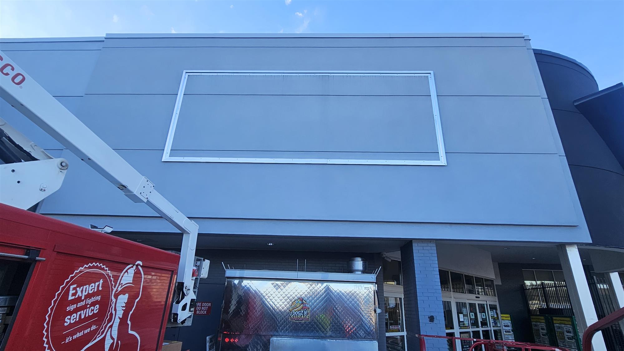outdoor wall being prepared for sign installation at Canadian Tire