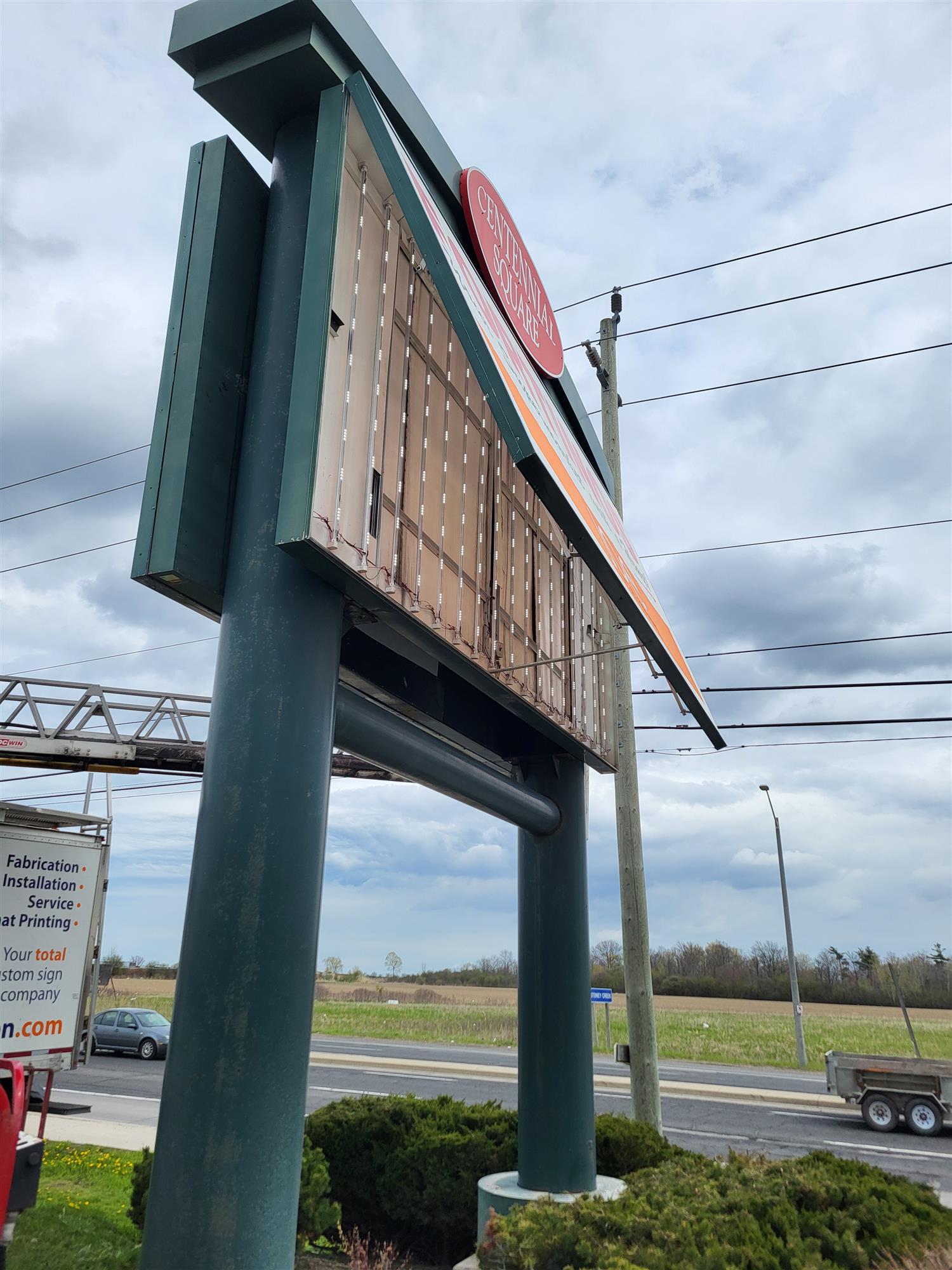 a large pylon sign opened to expose the lights inside