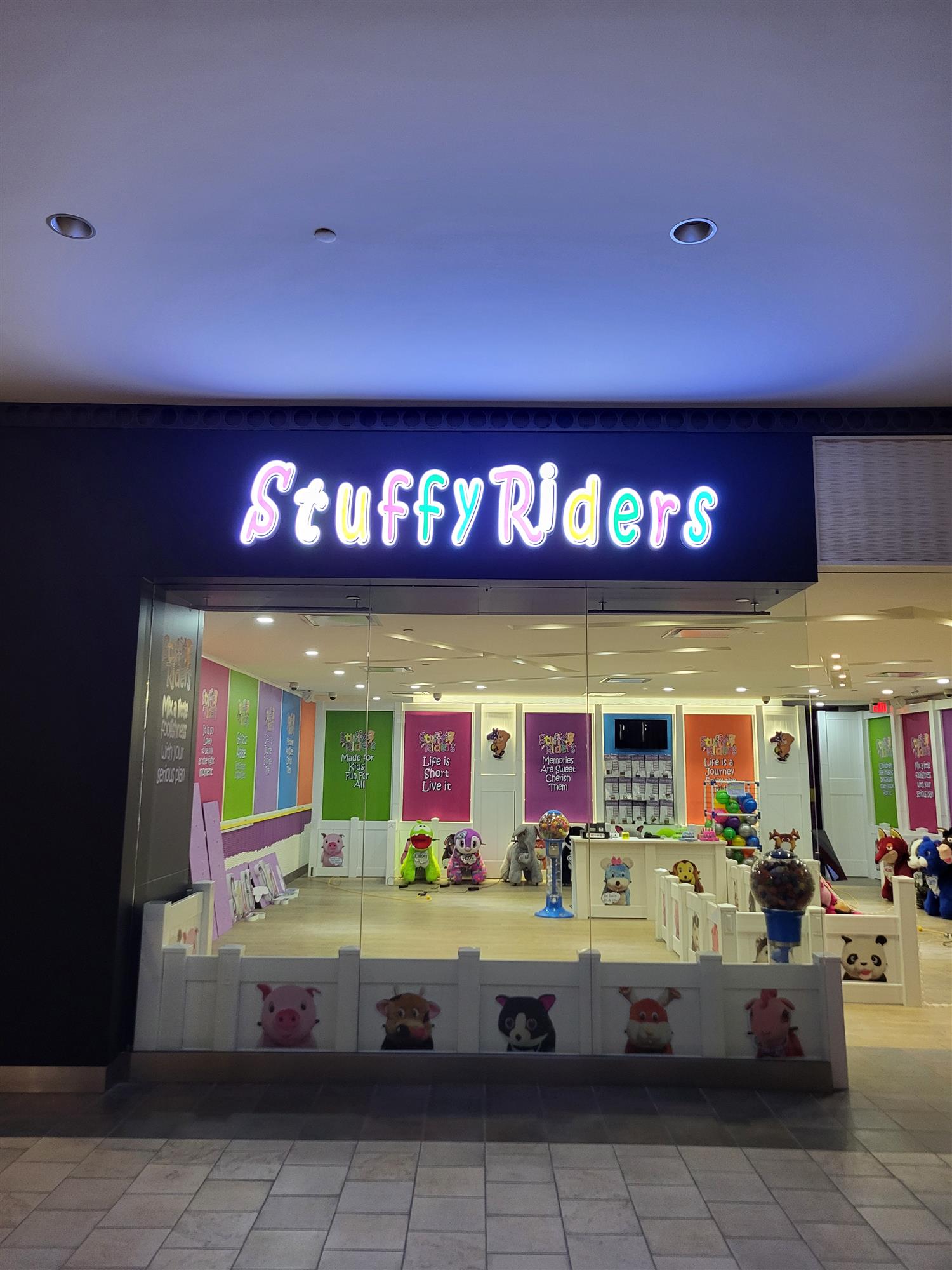 illuminated Stuffy Riders sign on store front inside Limeridge mall