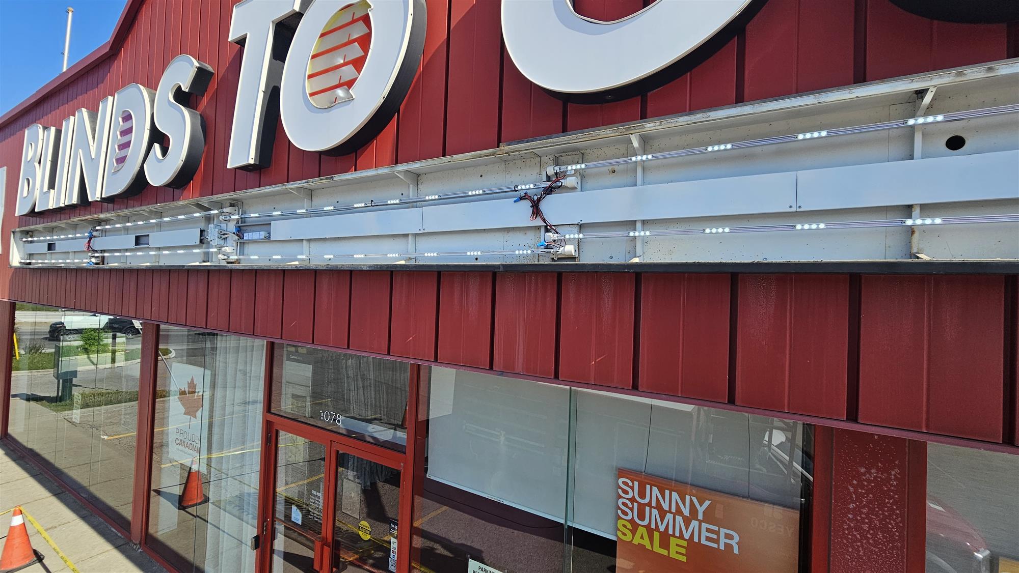 open sign panel on side of blinds to go store