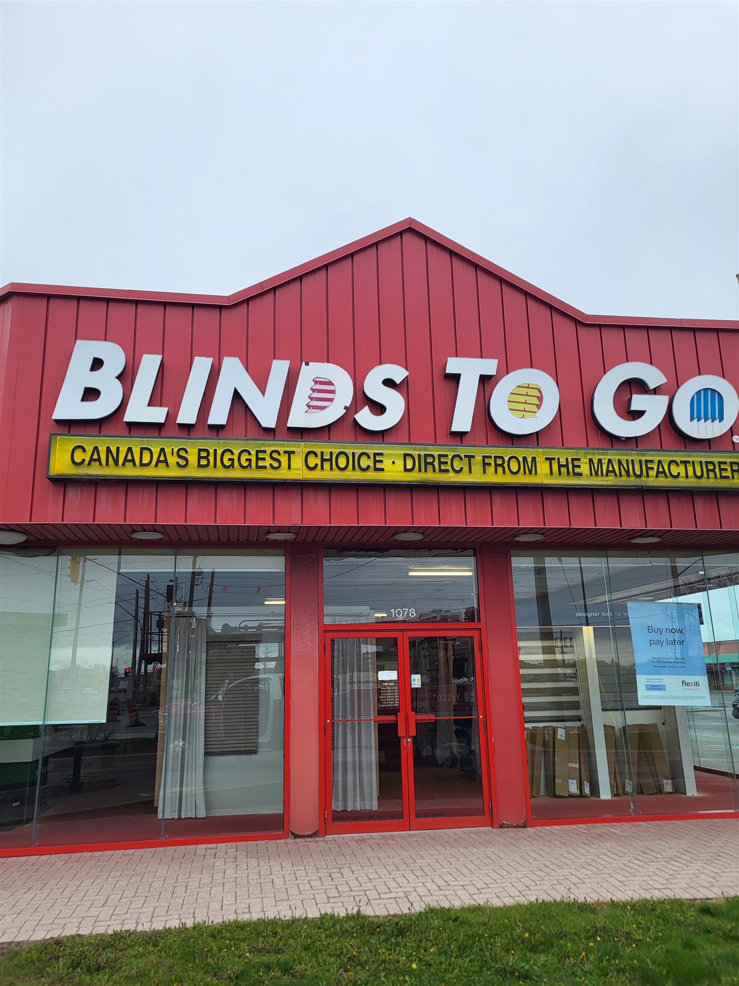 completed retrofit of Blinds to Go Sign over front entrance of building
