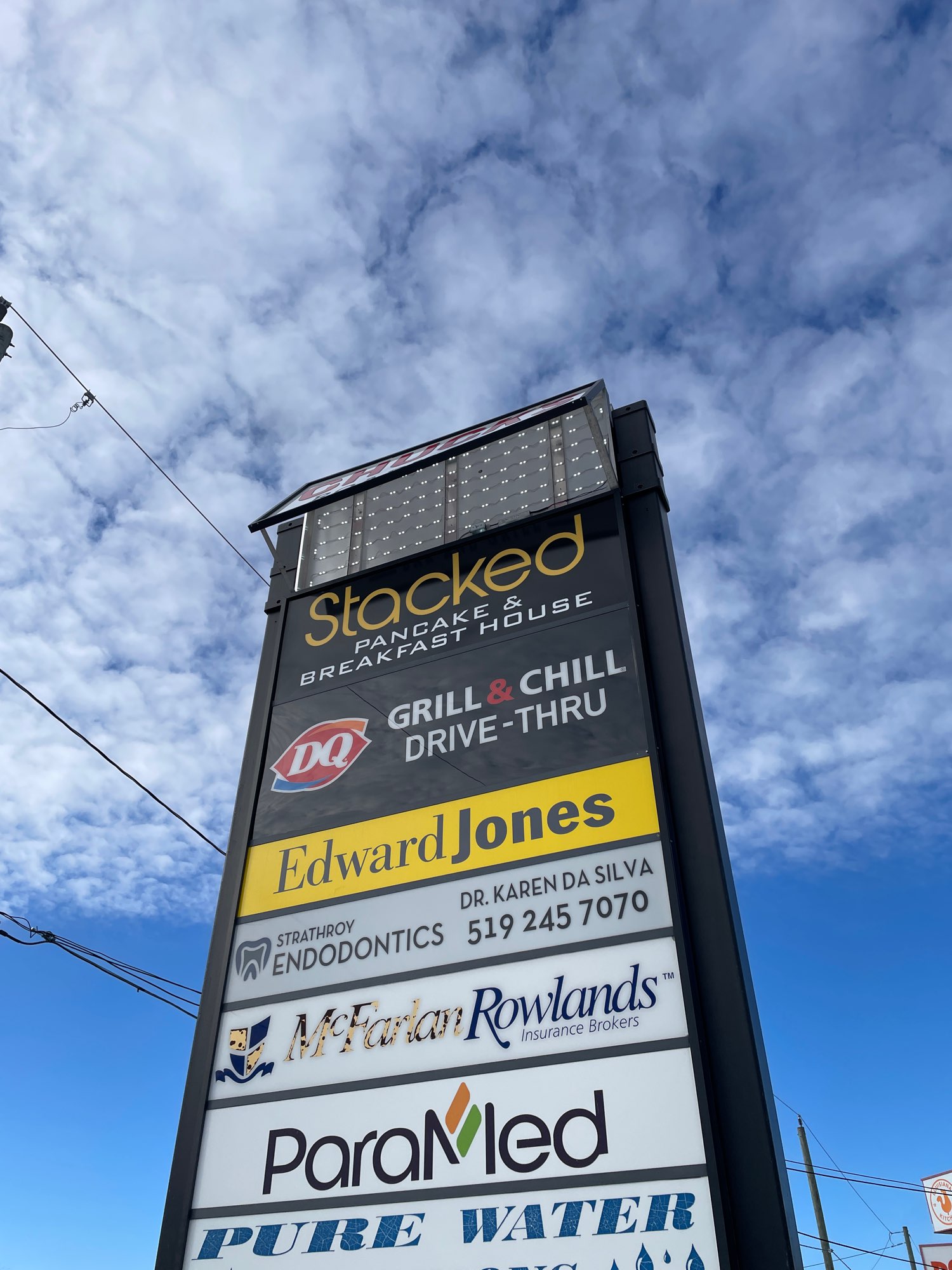large pylon sign repair Chucks road house with many other business listed