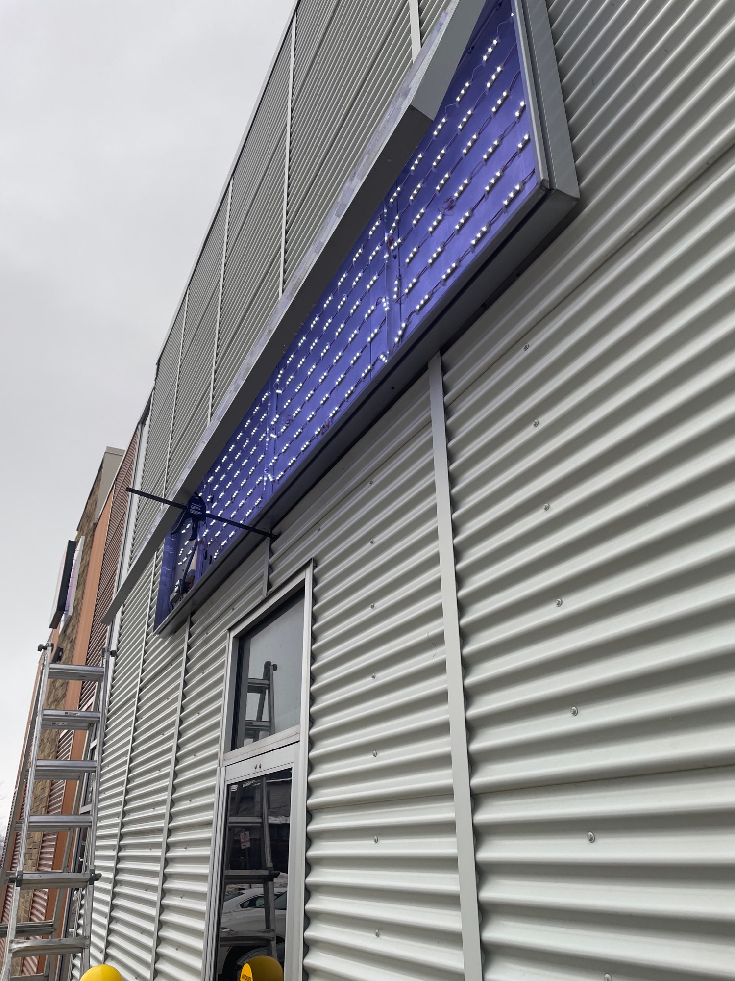 the inside of the Long and McQuade sign showing the repaired LED neon lights