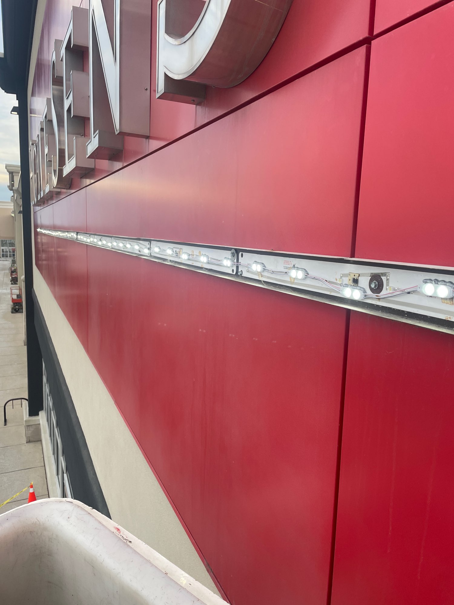 a red HomeSense sign with LED lights showing for a sign repair