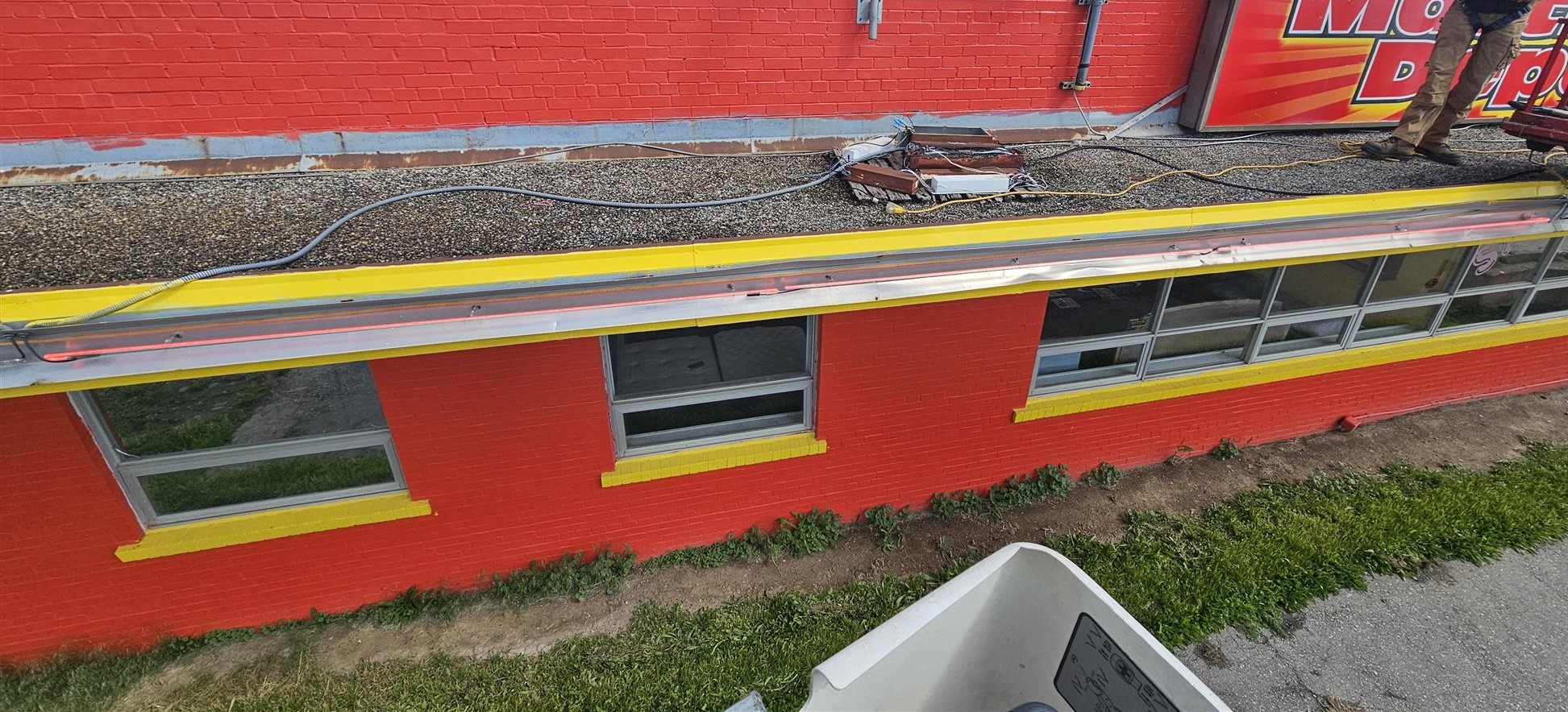 red and yellow brick with neon channel running along building