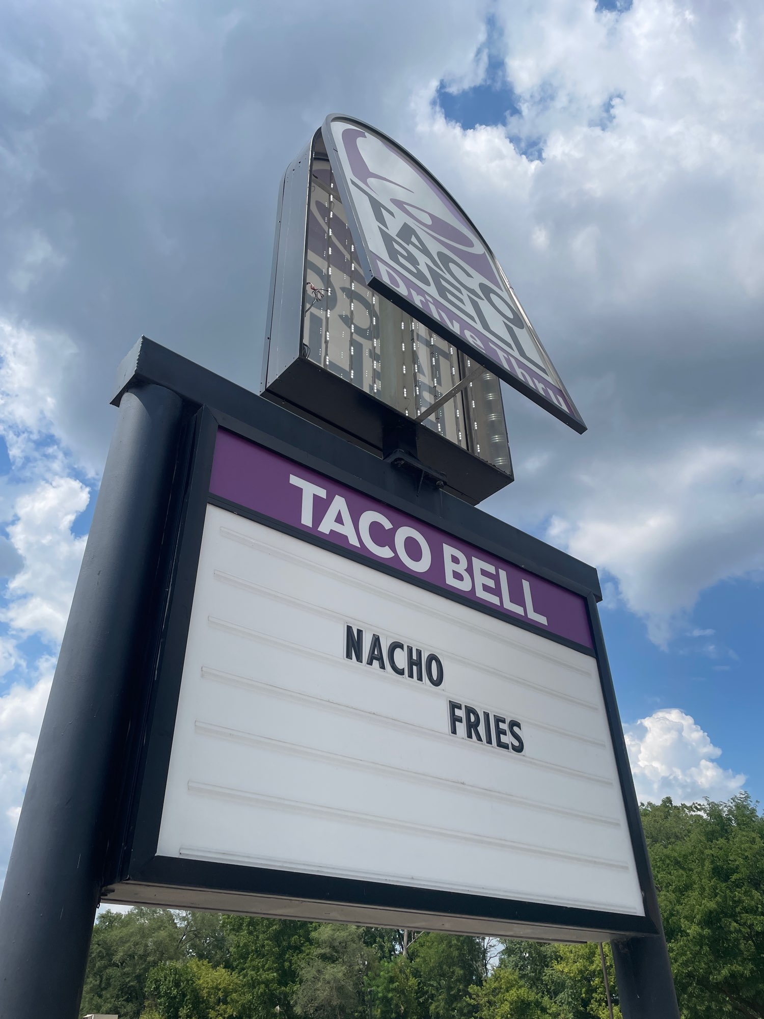 a large purple black and white Taco Bell pylon sign in Brantford Ontario
