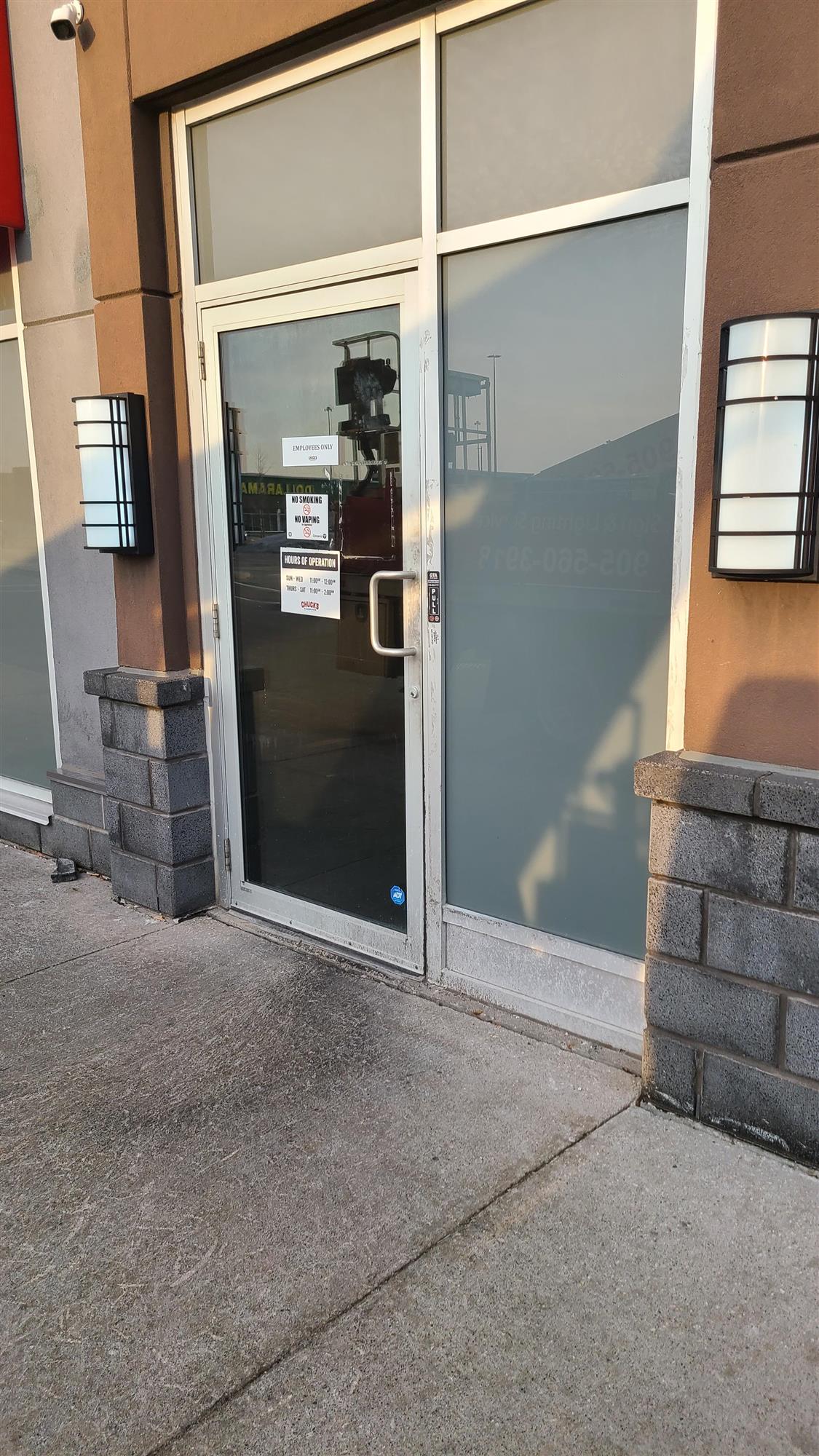 new wall sconces on the side of Chucks roadhouse restaurant