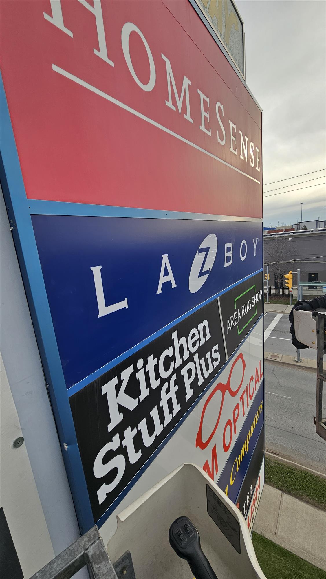 a multi business pylon sign with HomeSense and other businesses