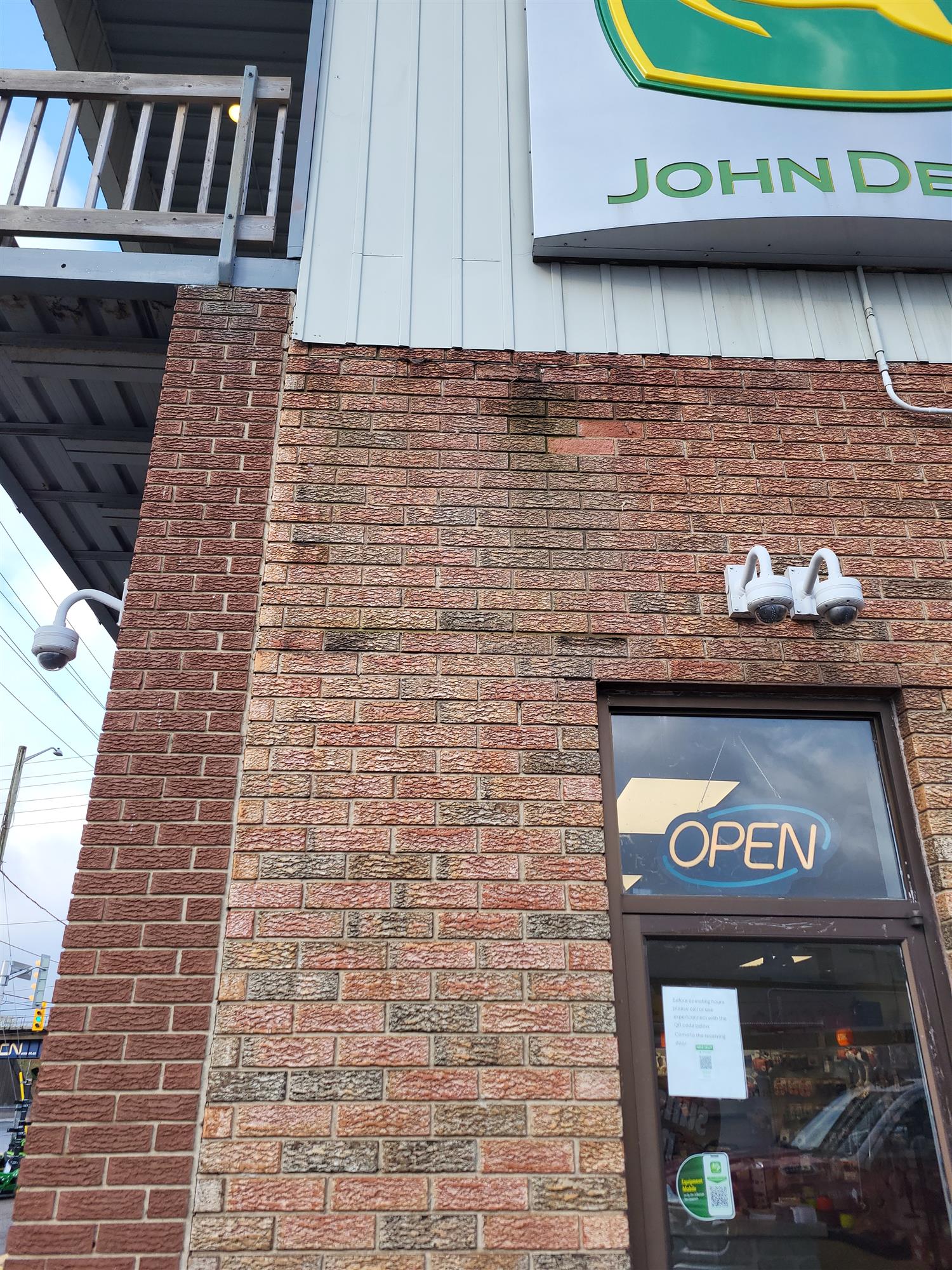 John Deere sign on side of building
