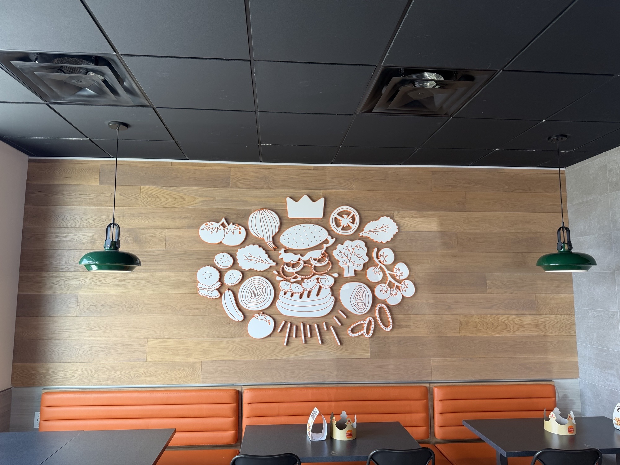 inside Burger King restaurant with wall decor and seating