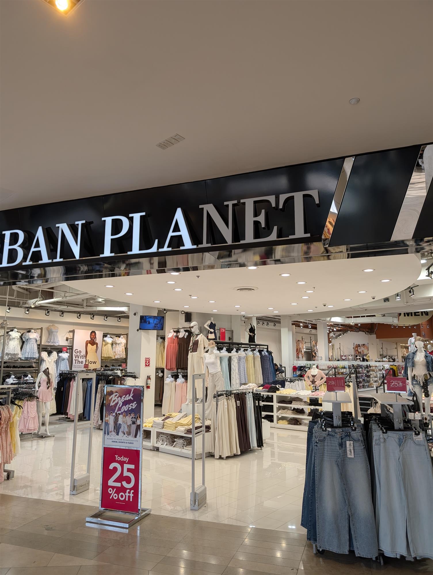 Urban Planet indoor mall sign with a few letters burnt out