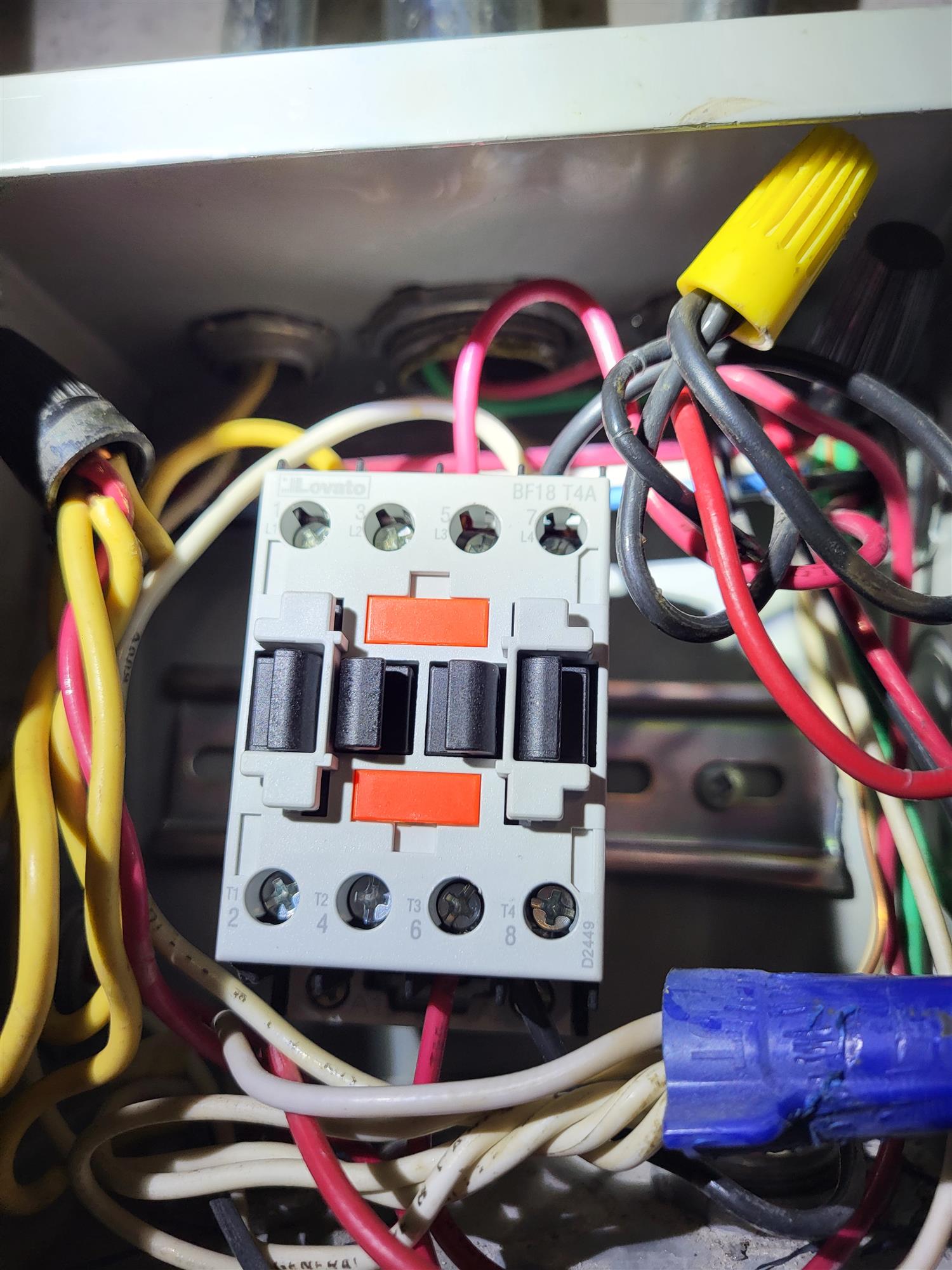a contactor box with wires and switches