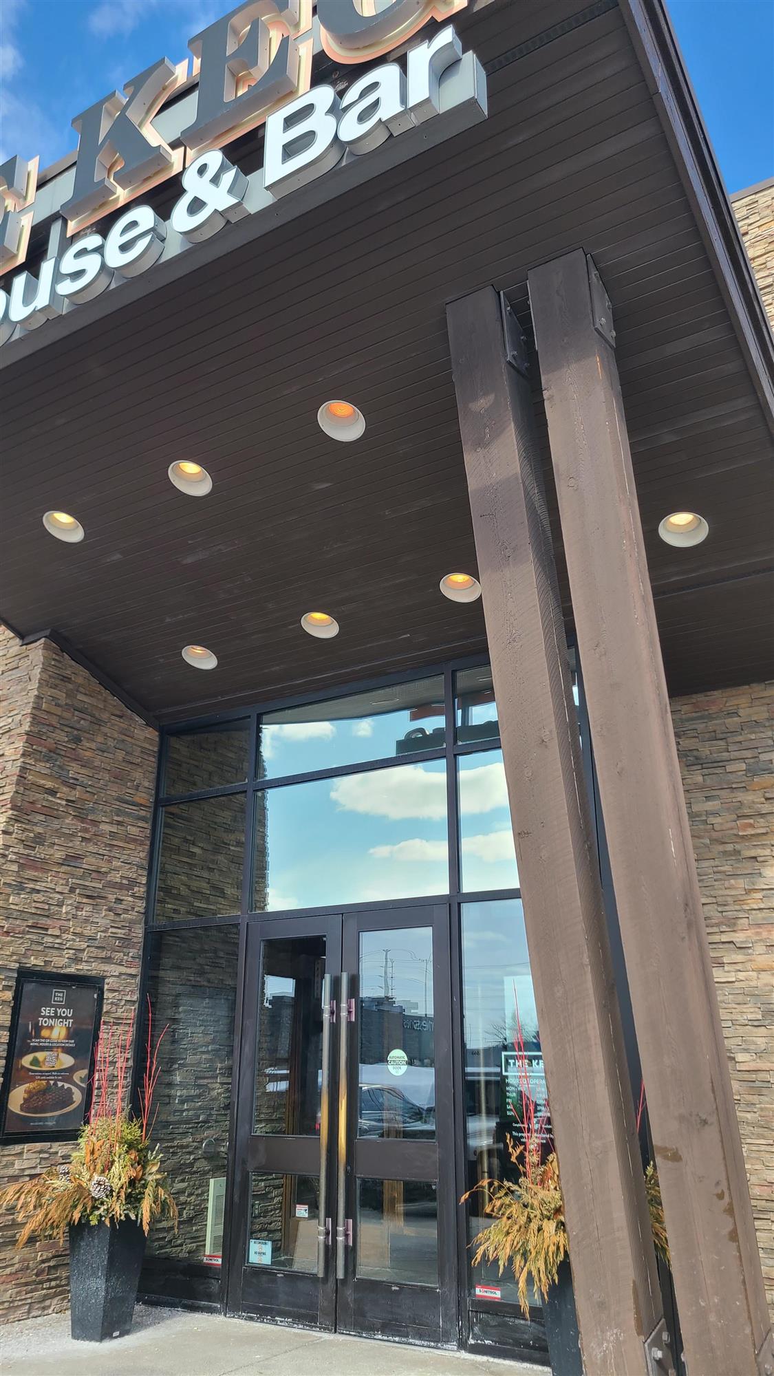 Outside of The Keg restaurant with pot lights illuminated