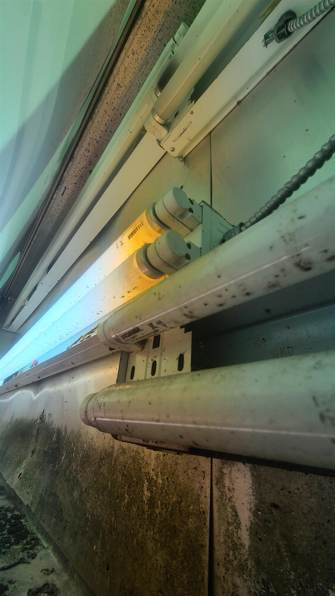 the inside of an LED sign showing the long bulbs