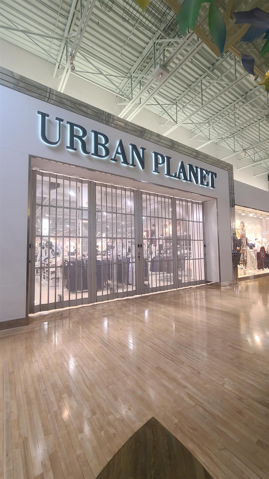 Urban Planet store sign with illuminated letters inside the Vaughan Mills shopping mall