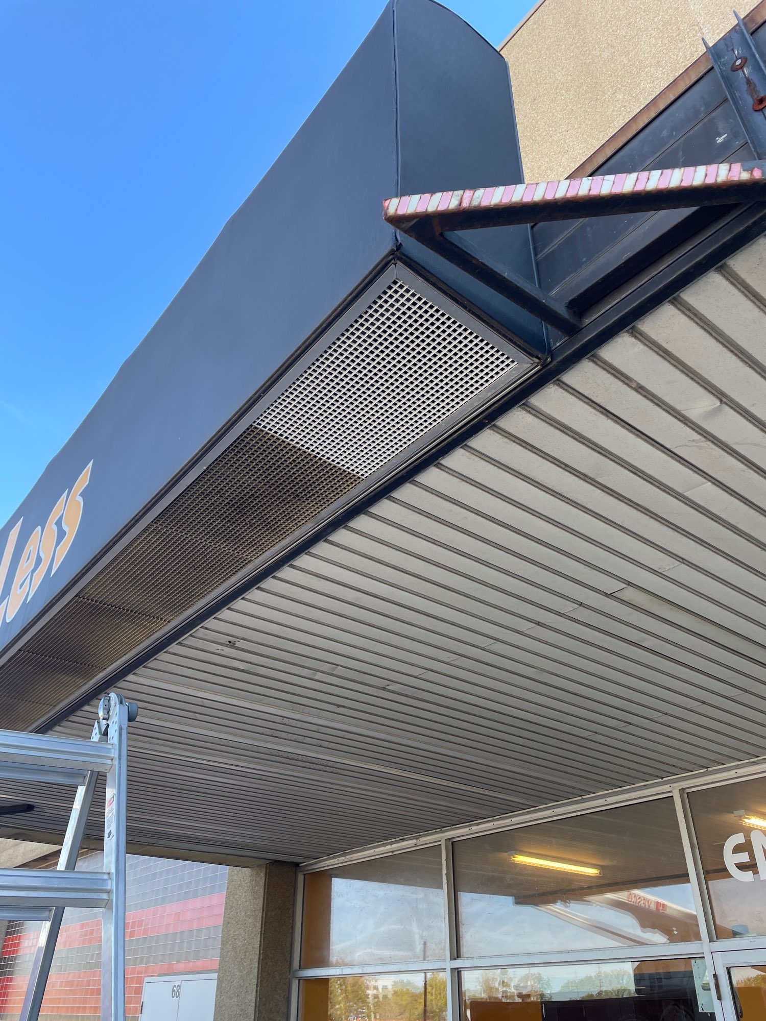 the outside view of the sign at fit4less gym