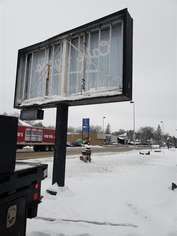 back side of a sign with snow buildup